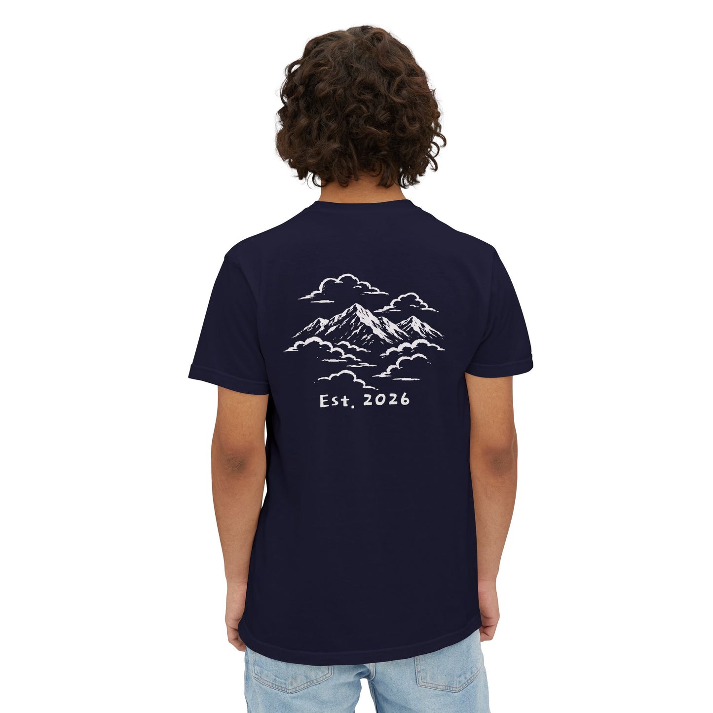 Model wearing the True Navy tee, back view showing the mountains-in-the-clouds print