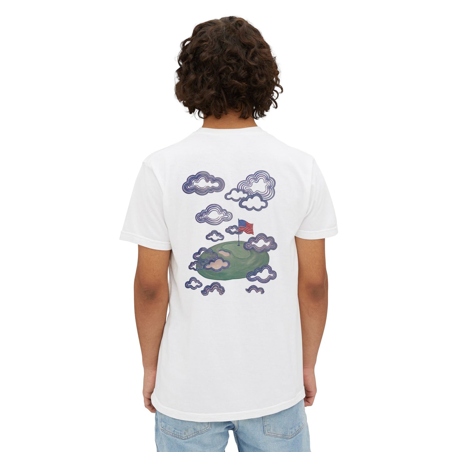 Model wearing the white tee, back view showing the flag-in-the-clouds print