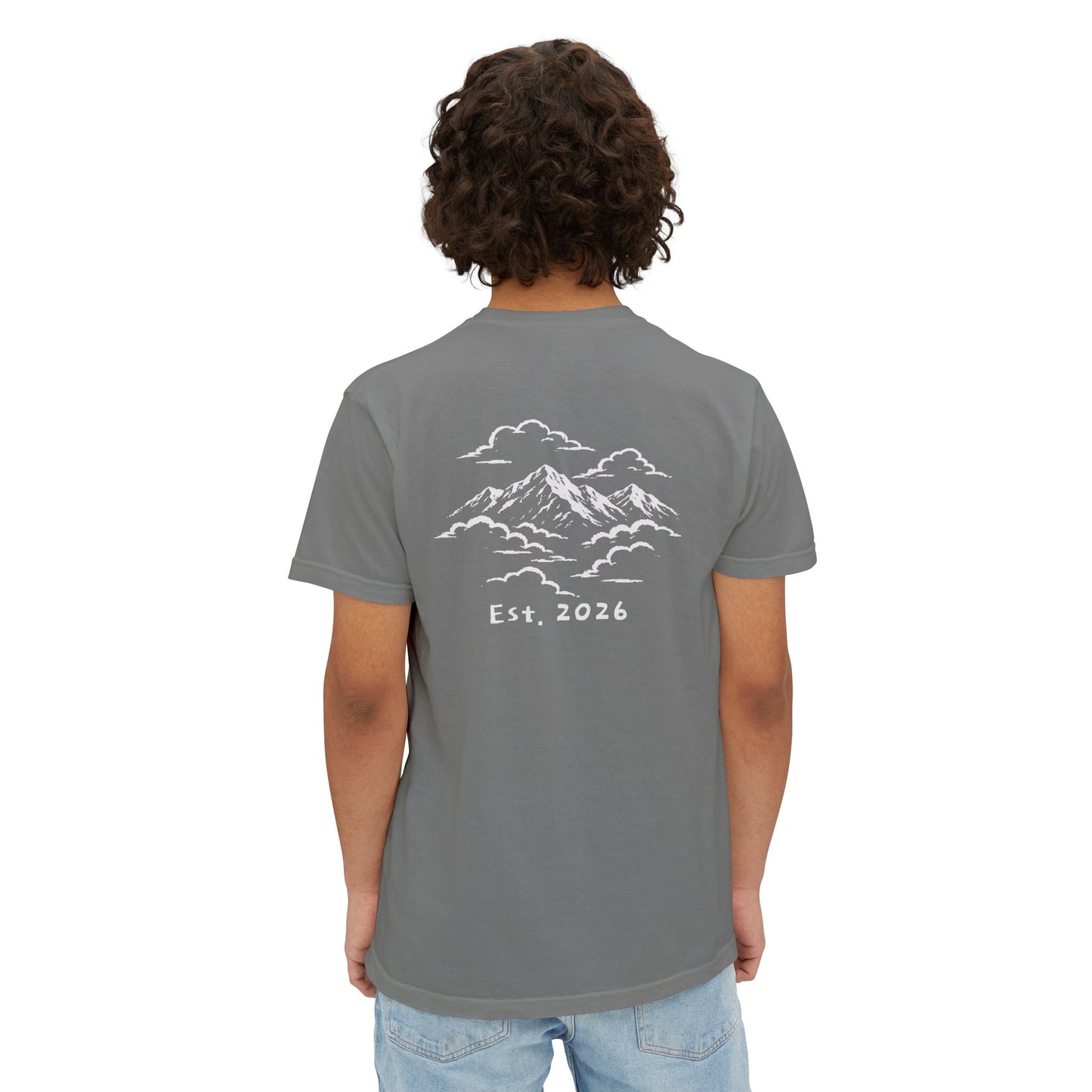 Model wearing the grey tee, back view showing the mountains-in-the-clouds print