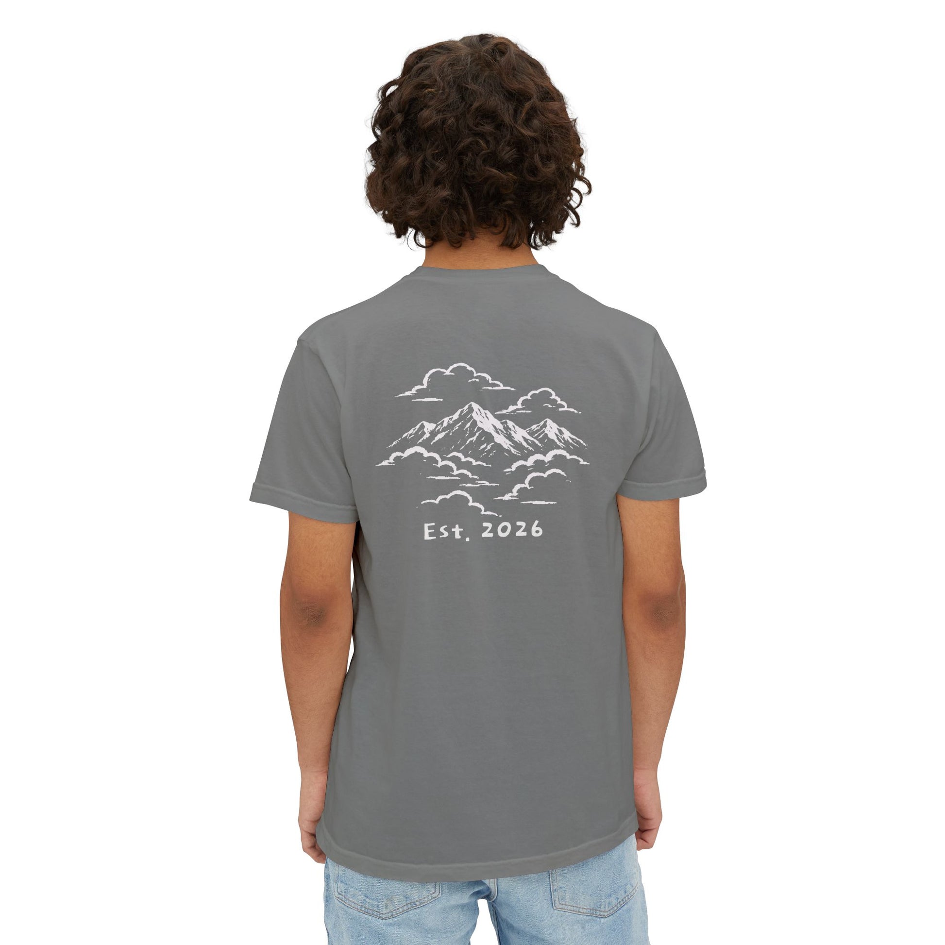 Model wearing the grey tee, back view showing the mountains-in-the-clouds print