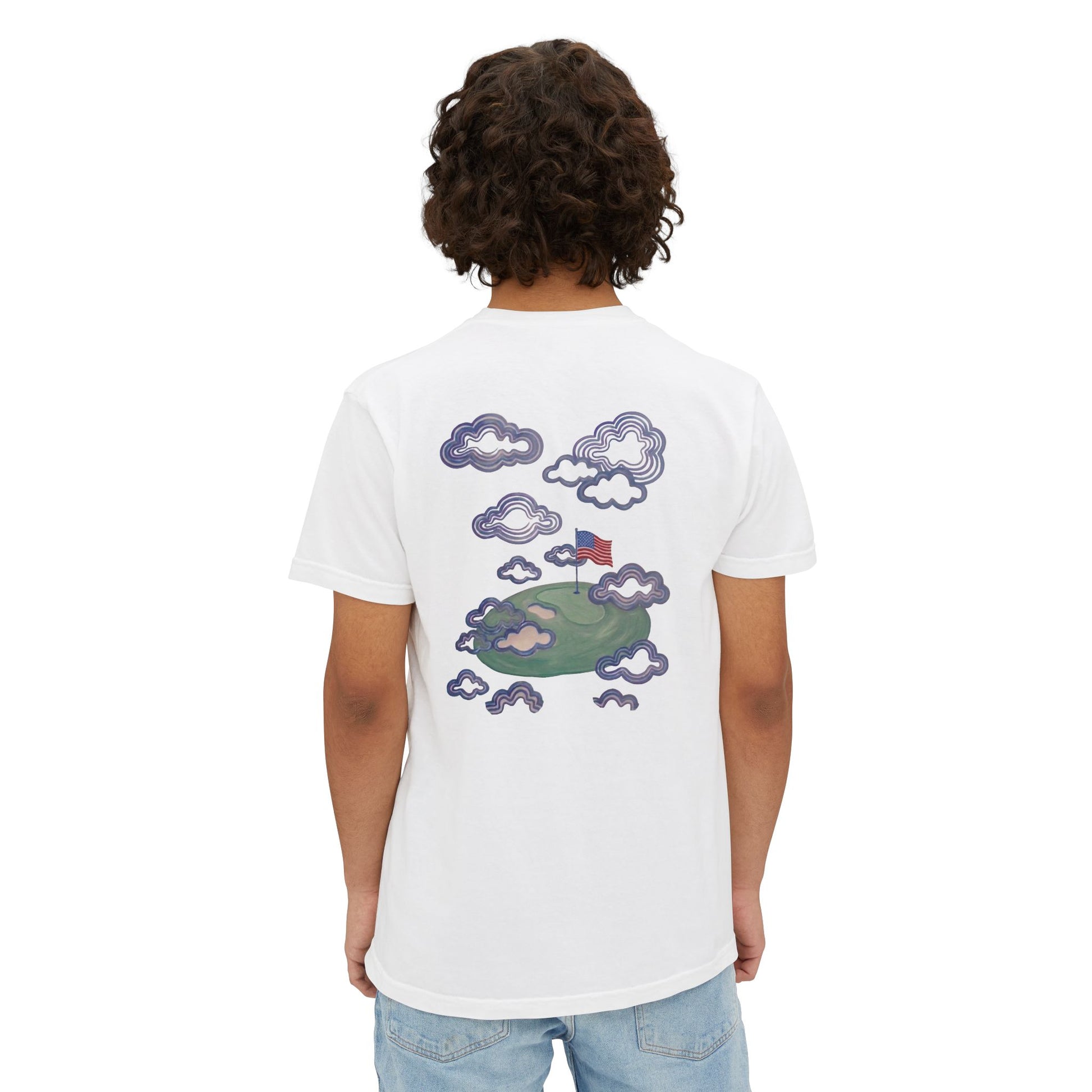 Model wearing the white tee, back view showing the flag-in-the-clouds print