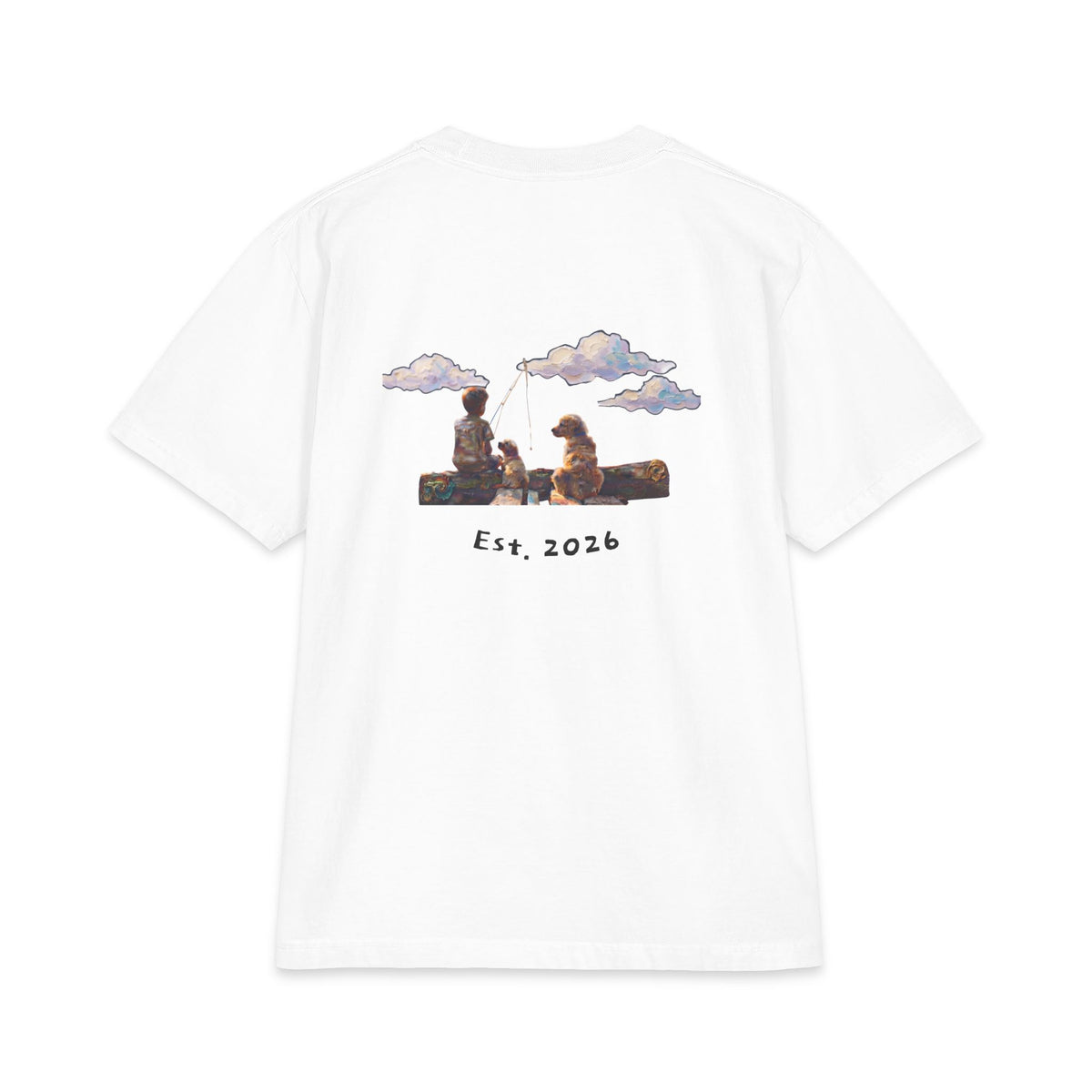 Back of white tee, painted boy fishing from a log with his two dogs under drifting clouds, Est. 2026 underneath