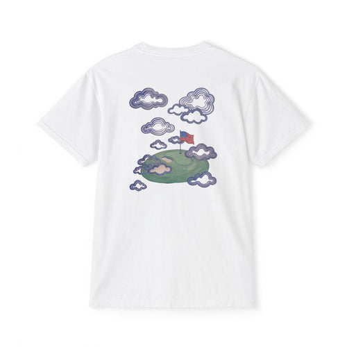 Back of white tee — hand-painted American flag planted on a floating green island among clouds